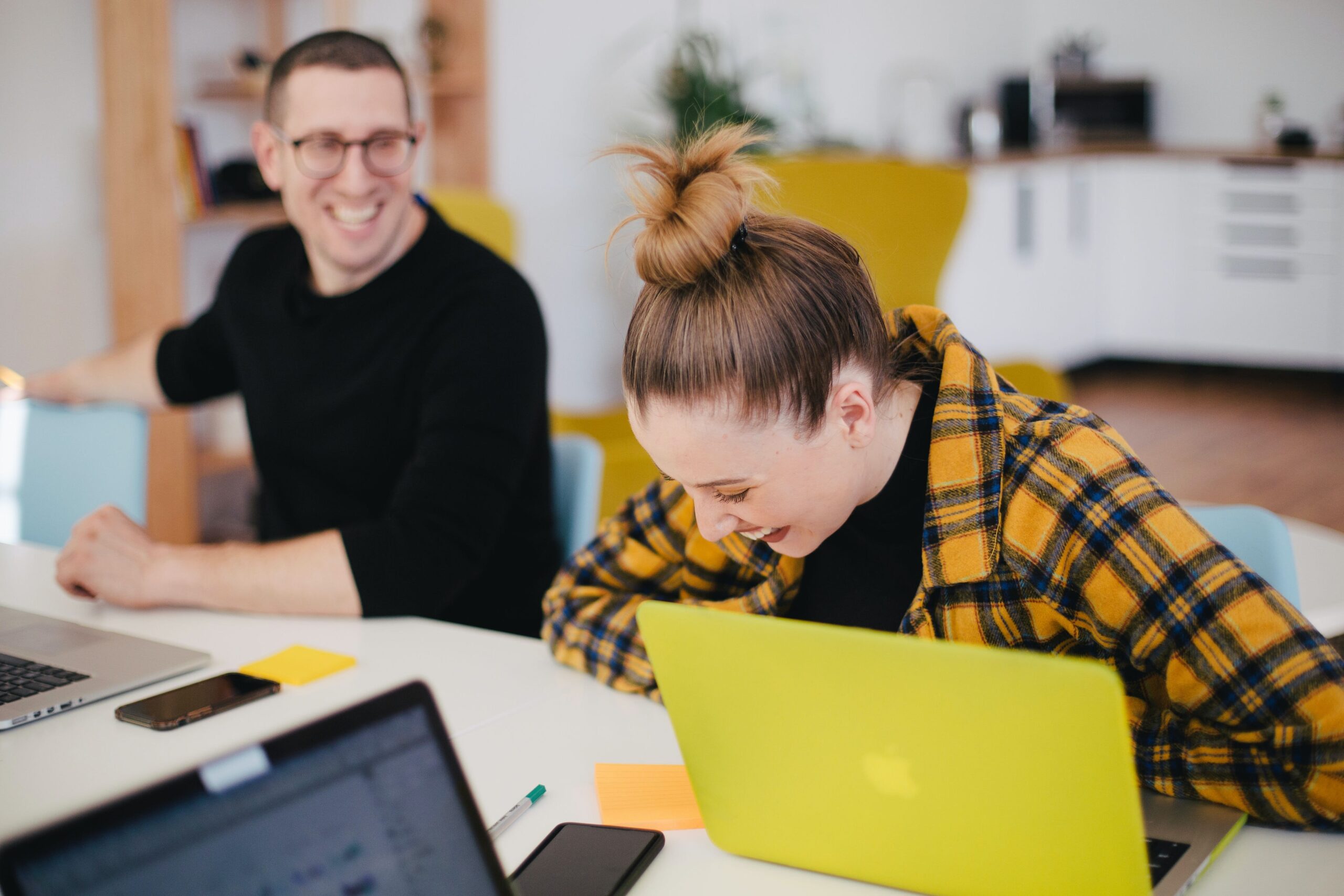 Co-workers collaborating through integrated applications - What is Workflow Automation? Workflow Automation Part 1 - Blog