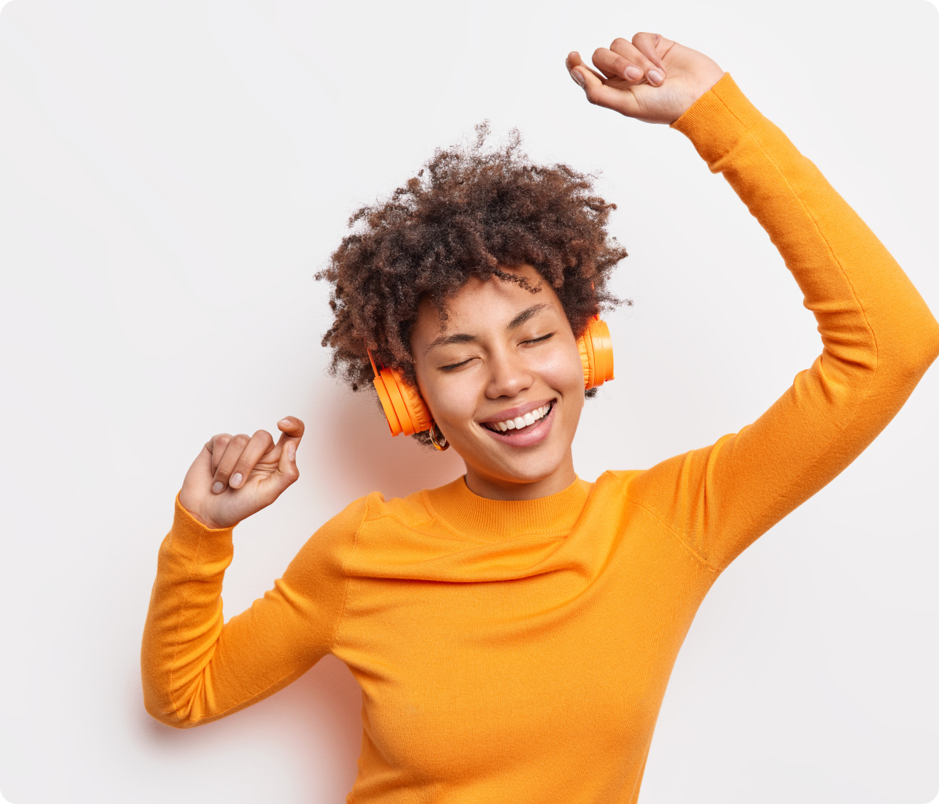 Marketing team member in orange shirt dancing to music - Marketing Automation