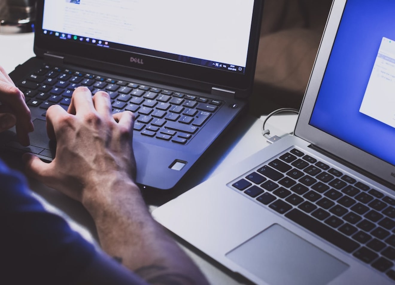 Two laptops displaying Harmony support - Professional Services